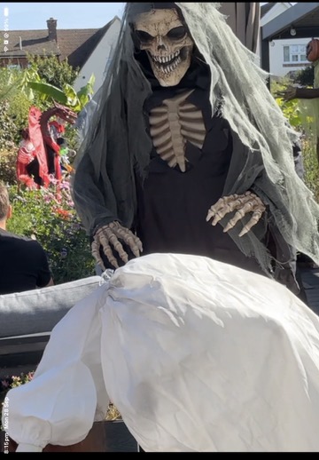 Reaper with Levitating Woman